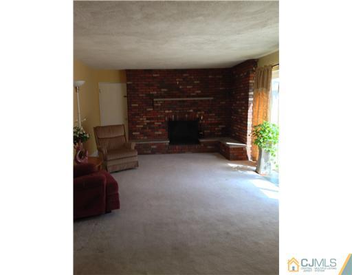 60 Eardley Road Edison, NJ 08817 - Photo 16 of 17 a living room with furniture and a fireplace