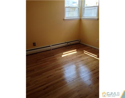 60 Eardley Road Edison, NJ 08817 - Photo 8 of 17 a view of a room with wooden floor and a window