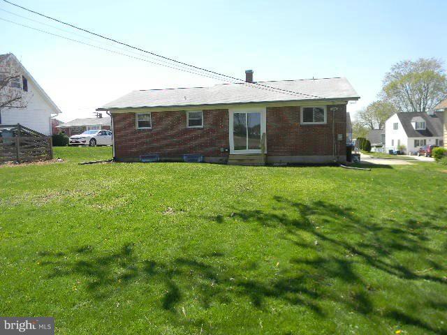 9634 Dundawan Road Baltimore, MD 21236 - Photo 16 of 18 a front view of a house with a garden