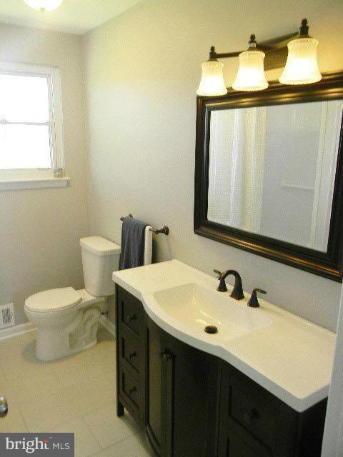 9634 Dundawan Road Baltimore, MD 21236 - Photo 8 of 18 a bathroom with a sink and a mirror