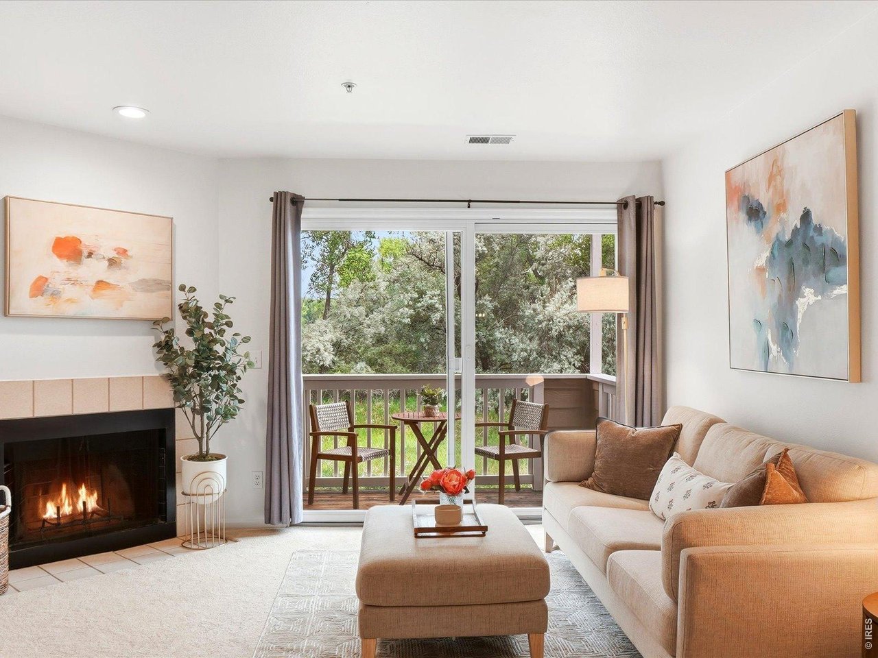 4945 Twin Lakes Road, Unit 46 Boulder, CO 80301 - Photo 10 of 42 Sliding glass doors lead to your private west-facing balcony overlooking open space and mature trees.