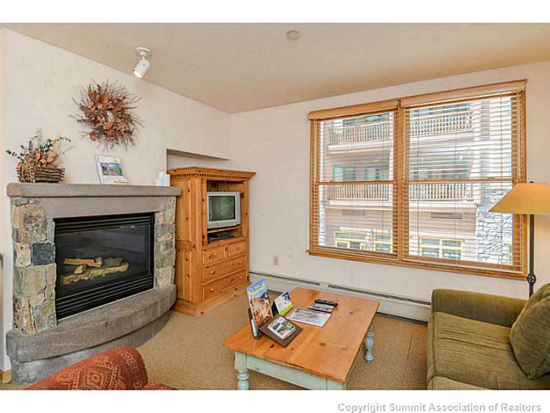 195 River Run Road, Unit 8045 Keystone, CO 80435 - Photo 2 of 15 a living room with furniture and a fireplace