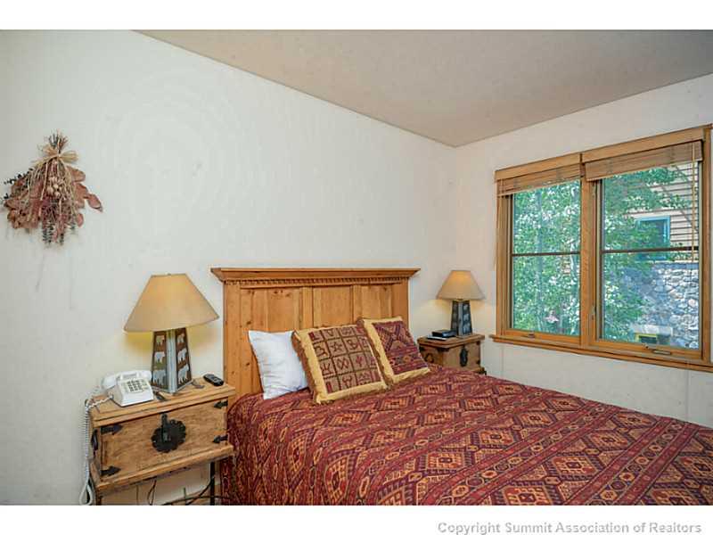 195 River Run Road, Unit 8045 Keystone, CO 80435 - Photo 9 of 15 a bedroom with a bed and a window