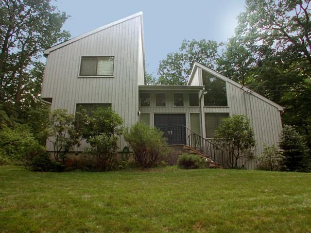 122 Gun Club Road Stamford, CT 06903 - Photo 1 of 1 a view of a house with backyard and garden