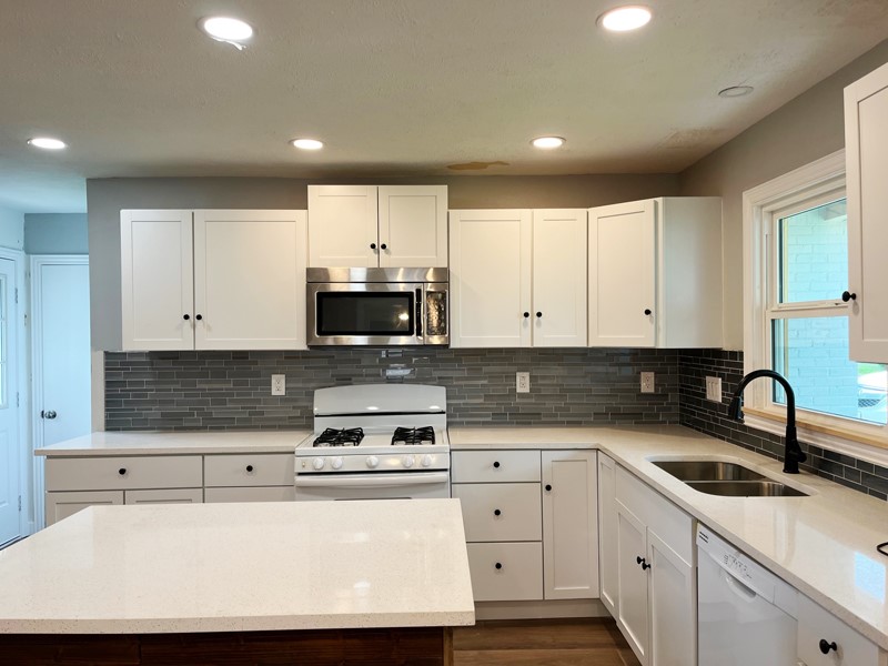 3522 Rosedale Street Houston, TX 77004 - Photo 1 of 22 a kitchen with sink a stove and cabinets