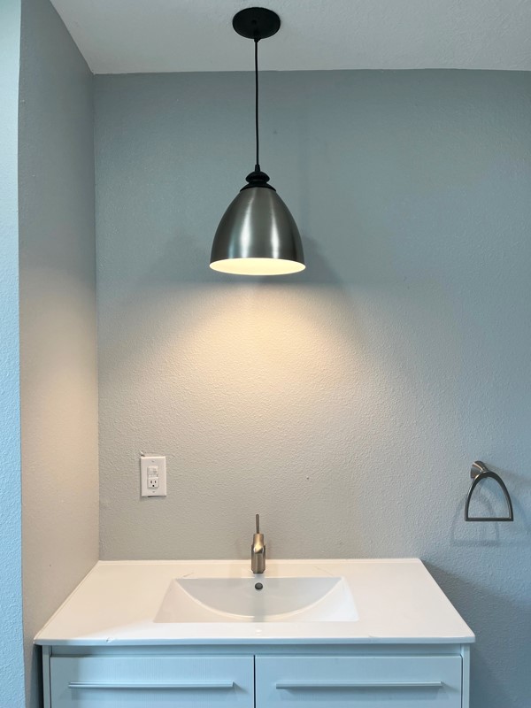 3522 Rosedale Street Houston, TX 77004 - Photo 11 of 22 a bathroom with a sink and a shower