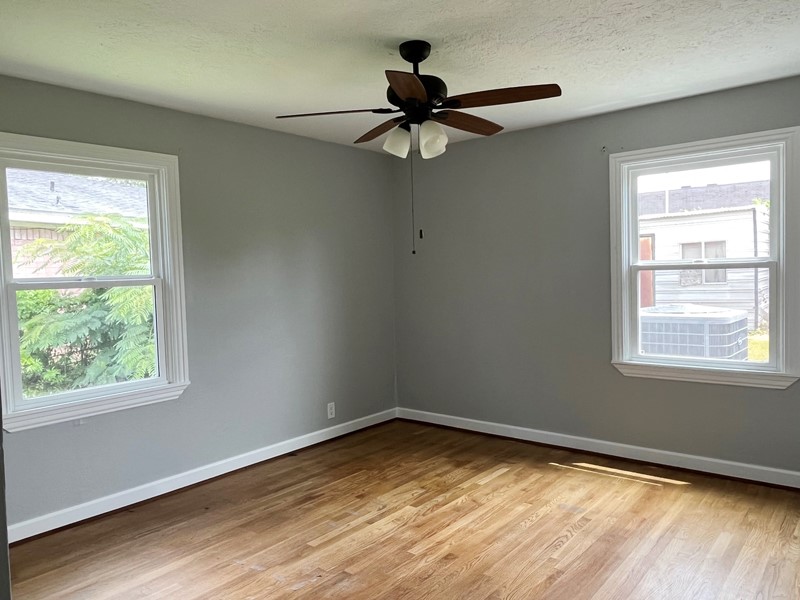 3522 Rosedale Street Houston, TX 77004 - Photo 12 of 22 a view of empty room with wooden floor and fan