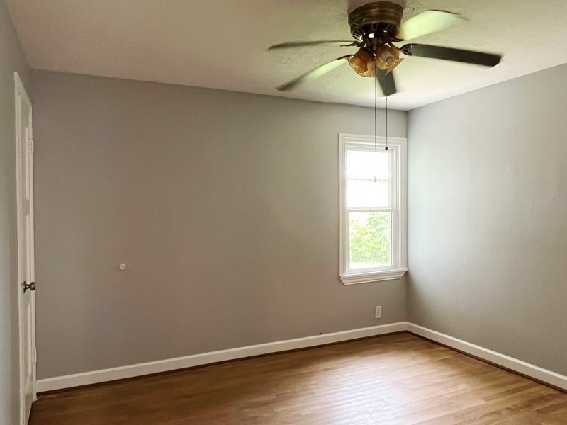 3522 Rosedale Street Houston, TX 77004 - Photo 13 of 22 an empty room with a window and a fan
