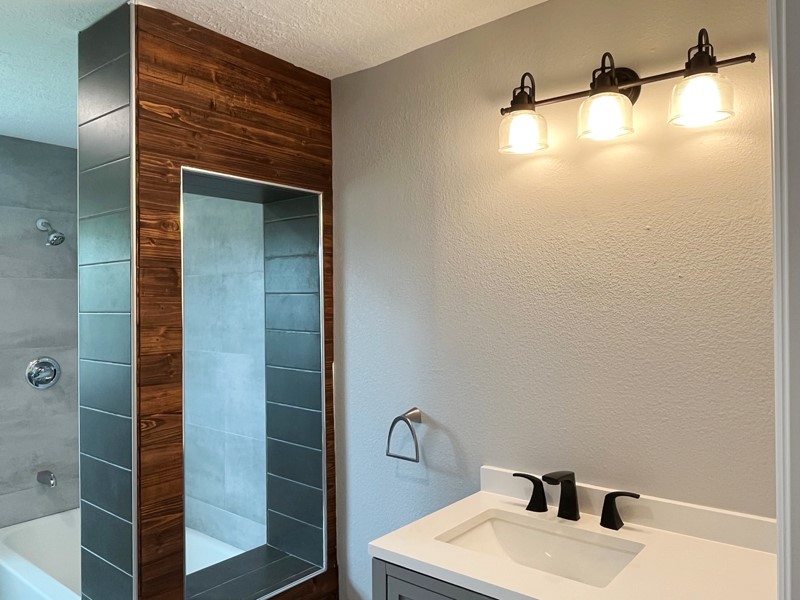 3522 Rosedale Street Houston, TX 77004 - Photo 14 of 22 a bathroom with a sink and shower