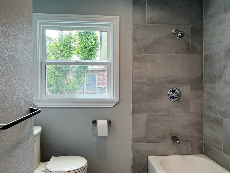 3522 Rosedale Street Houston, TX 77004 - Photo 15 of 22 a white toilet sitting next to a bathroom sink