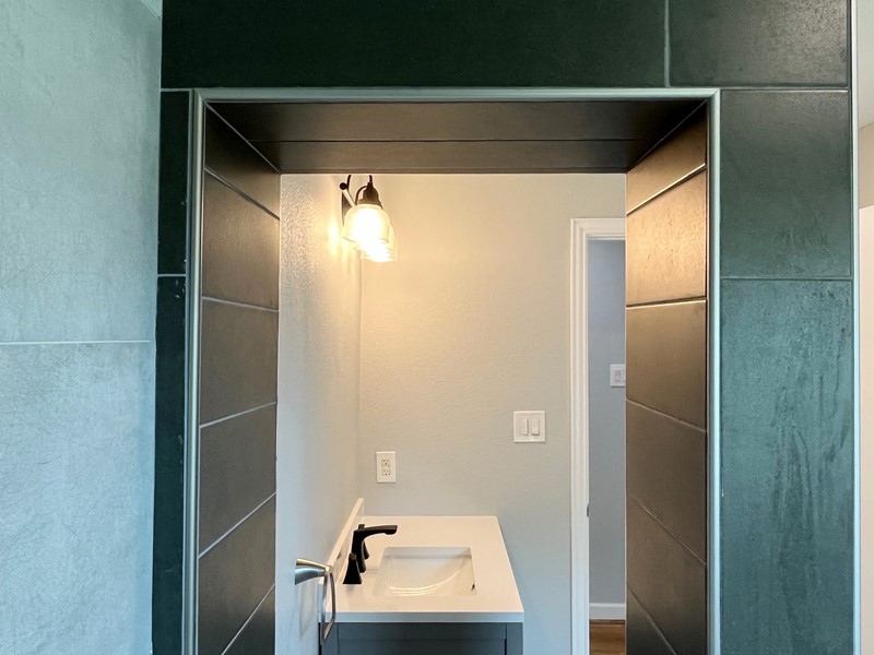 3522 Rosedale Street Houston, TX 77004 - Photo 16 of 22 a bathroom with a sink and mirror