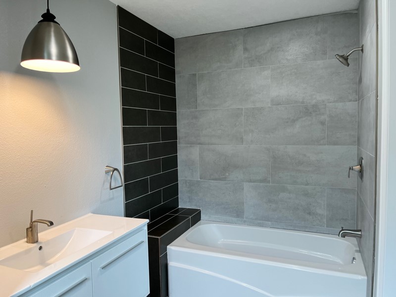 3522 Rosedale Street Houston, TX 77004 - Photo 9 of 22 a bathroom with a sink and a vanity