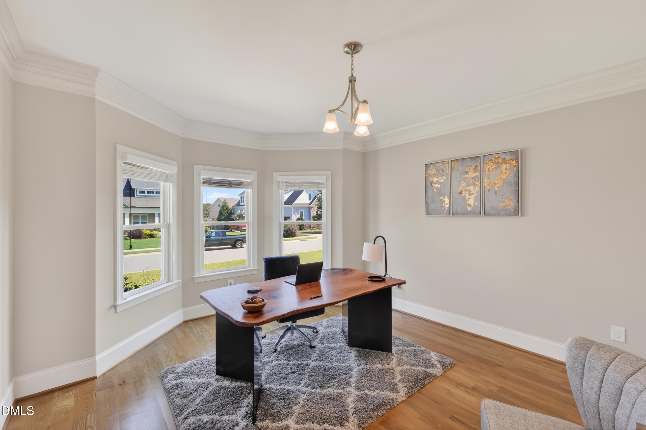 261 Character Drive Rolesville, NC 27571 - Photo 13 of 77 a view of a dining room with furniture wooden floor and chandelier