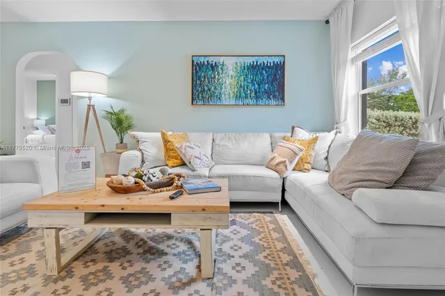 a living room with furniture and a window