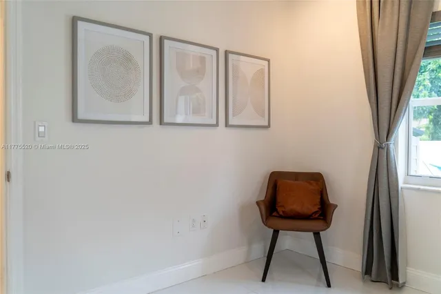 a view of room with window and hallway