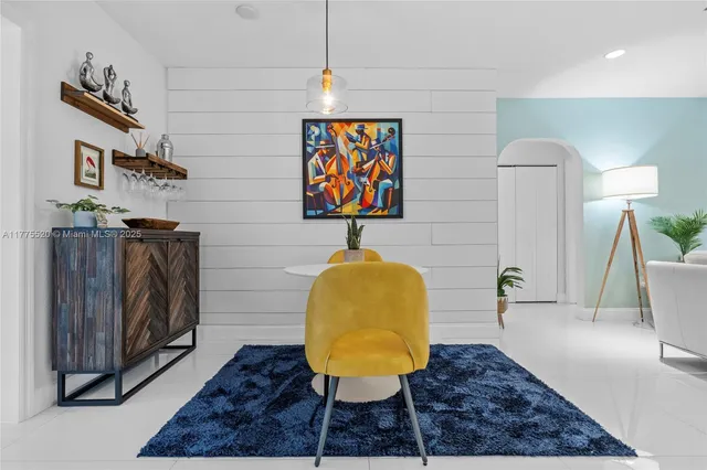 a living room with furniture and a rug