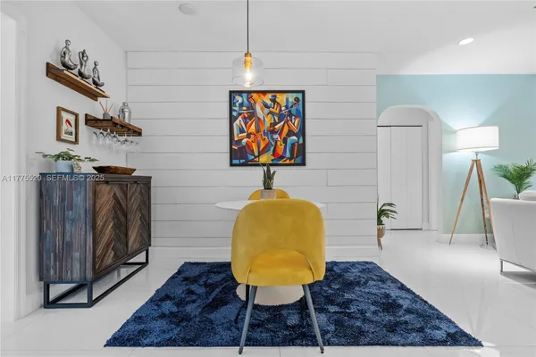 a living room with furniture and a rug
