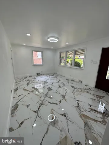 a view of a livingroom with furniture and window