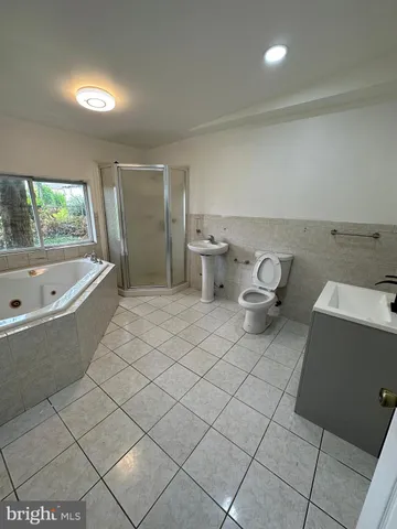 a bathroom with a sink toilet and bathtub