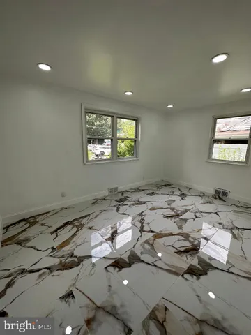 a view of a livingroom with furniture and window
