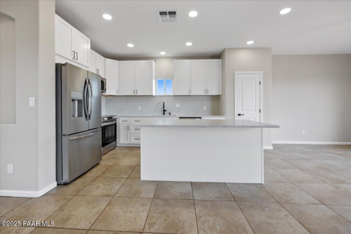320 South Hoss Road Dewey, AZ 86327 - Photo 12 of 42 a kitchen with cabinets and stainless steel appliances