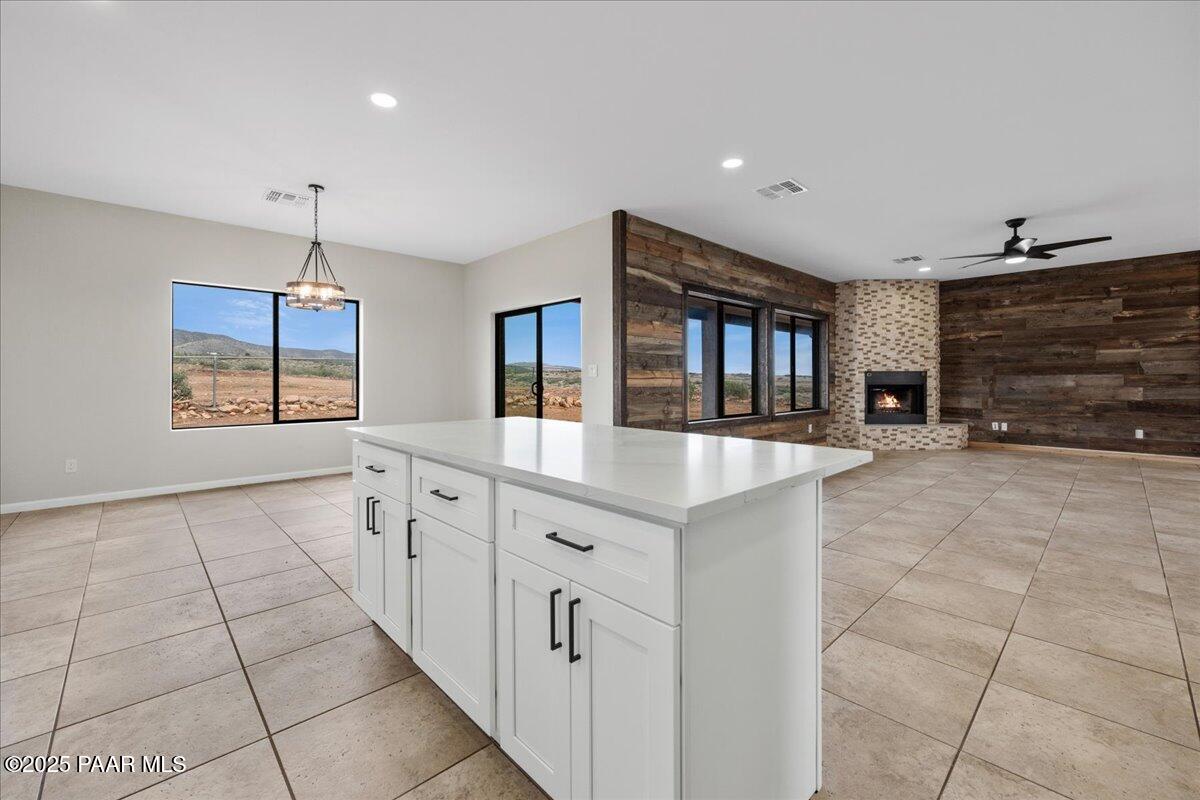 320 South Hoss Road Dewey, AZ 86327 - Photo 14 of 42 a large white kitchen with a sink and chandelier