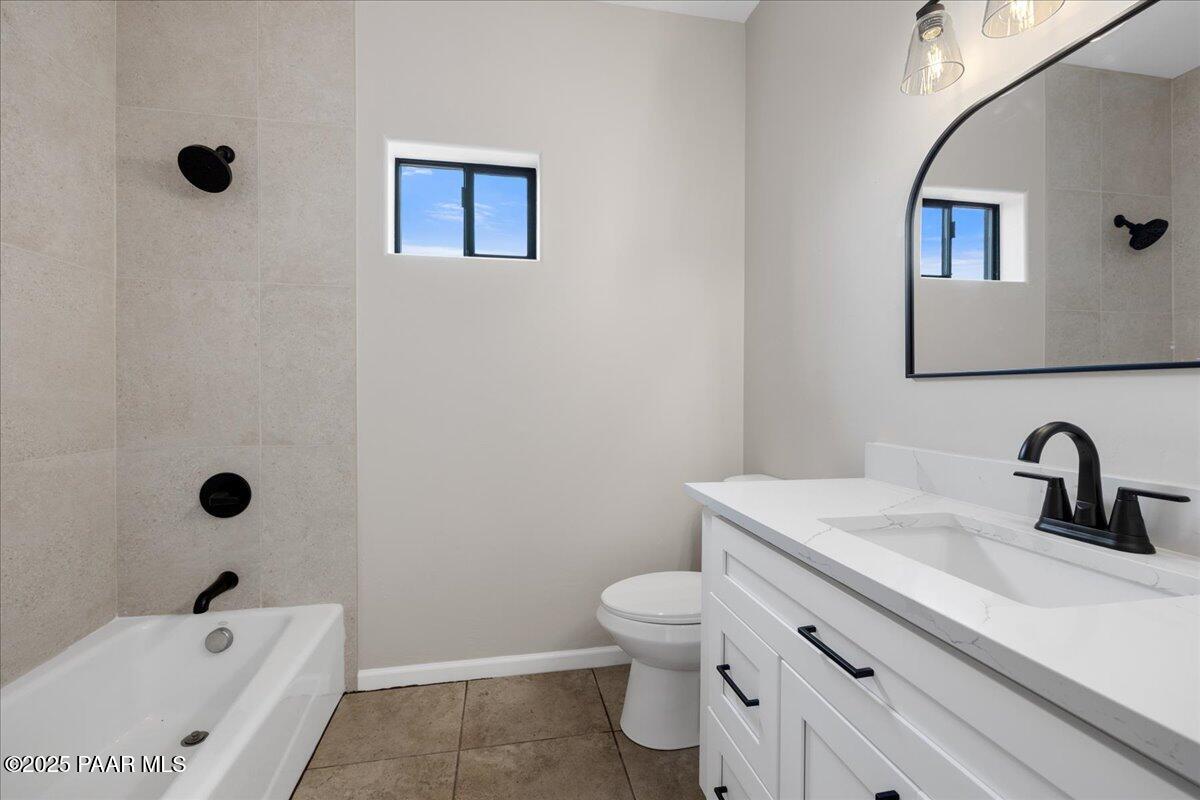 320 South Hoss Road Dewey, AZ 86327 - Photo 28 of 42 a bathroom with a sink toilet and shower