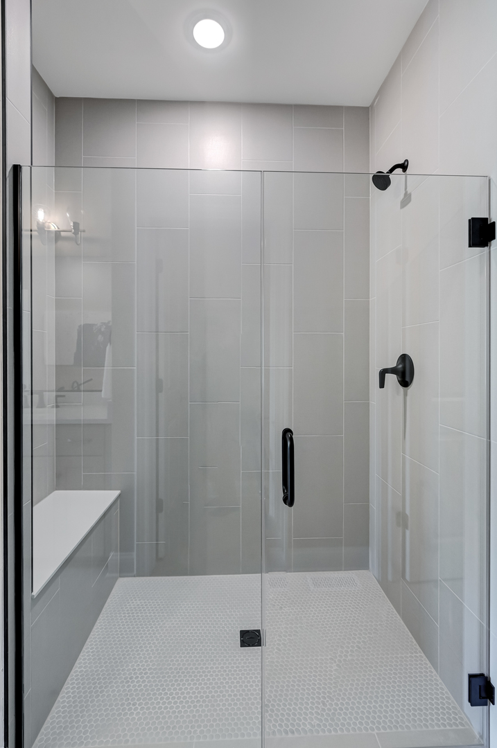 12215 Copper Ridge Drive, Unit 13 Lemont, IL 60439 - Photo 16 of 21 a bathroom with a shower and a toilet