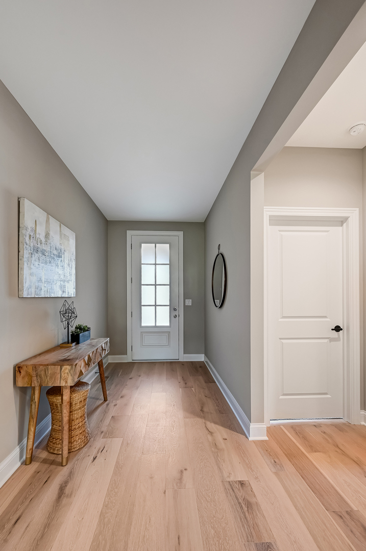 12215 Copper Ridge Drive, Unit 13 Lemont, IL 60439 - Photo 2 of 21 a bedroom with a bed and a window