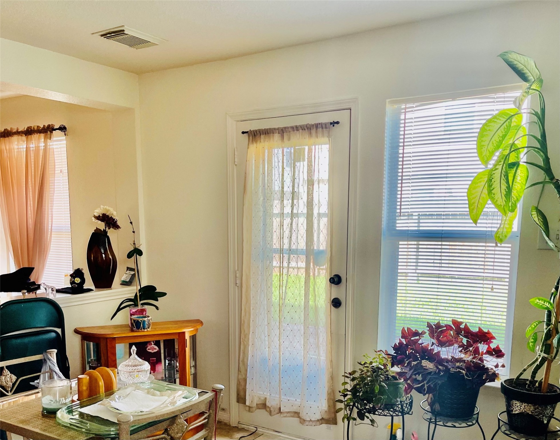 5707 Highbury Court Houston, TX 77084 - Photo 3 of 17 a view of a workspace with furniture and a potted plant