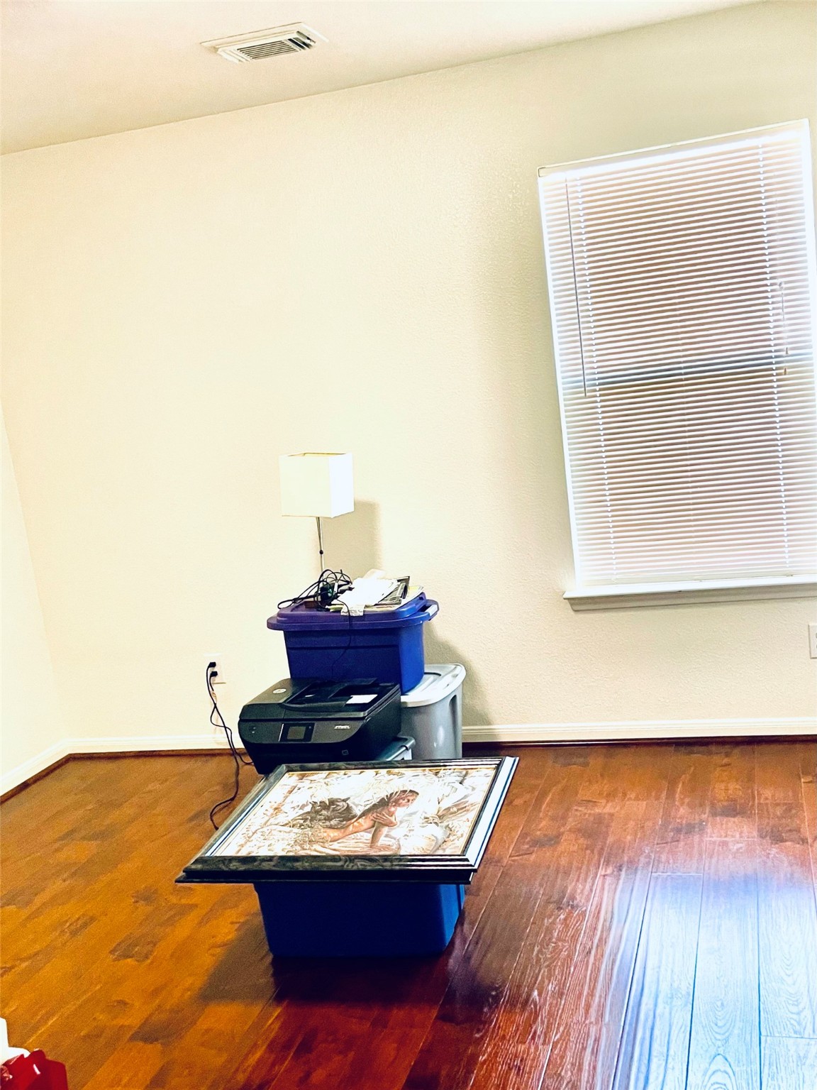 5707 Highbury Court Houston, TX 77084 - Photo 4 of 17 a room with a desk and chair with wooden floor