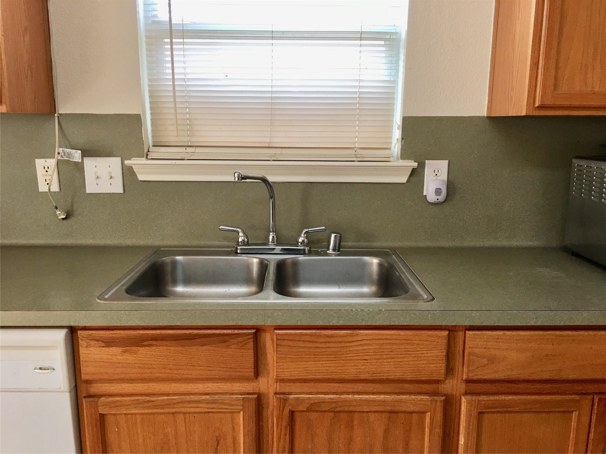 5707 Highbury Court Houston, TX 77084 - Photo 5 of 17 a kitchen with a sink cabinets and a window