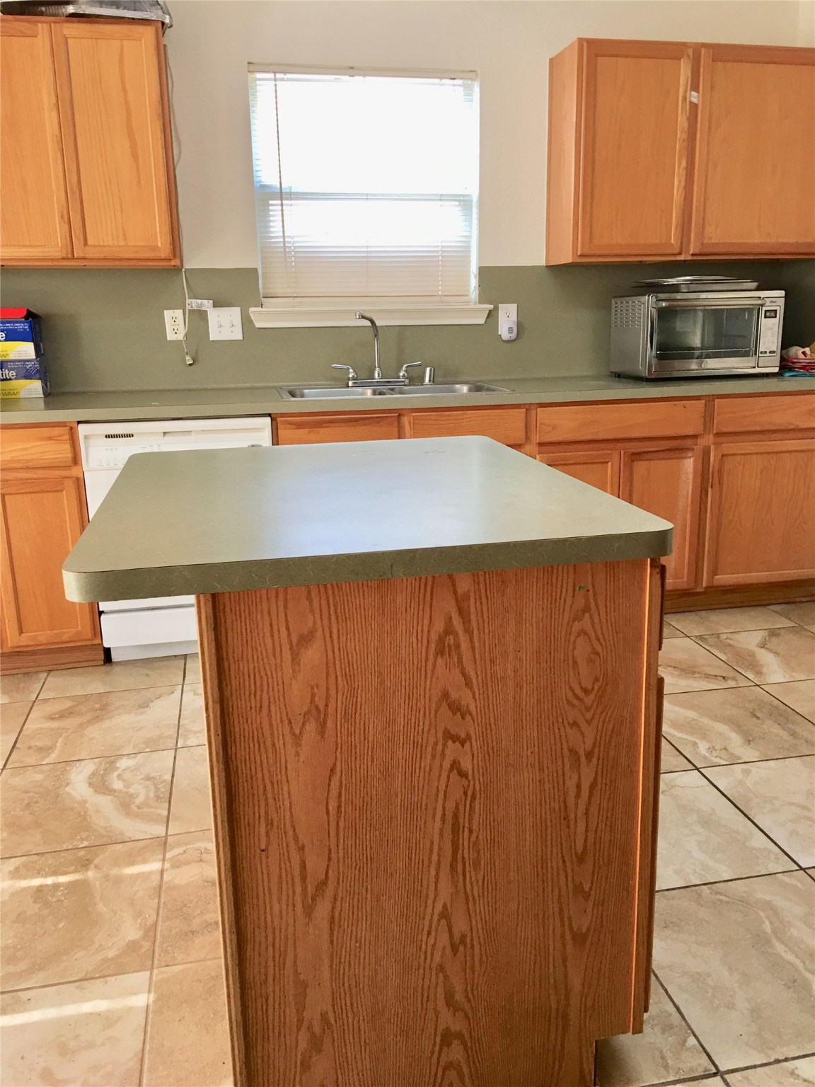 5707 Highbury Court Houston, TX 77084 - Photo 7 of 17 a kitchen with stainless steel appliances granite countertop a sink and a microwave