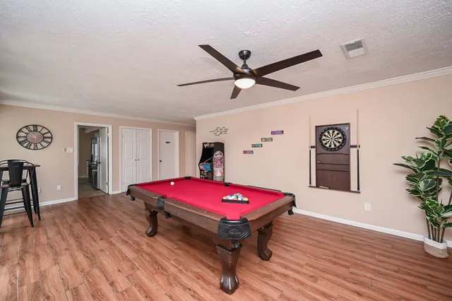 a room with furniture and pool table