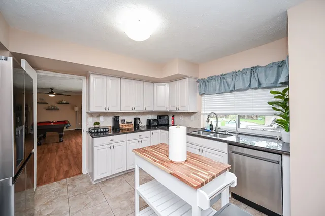 a view of a dining room with furniture window and outside view