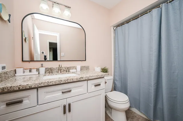 a bedroom with furniture and baby crib