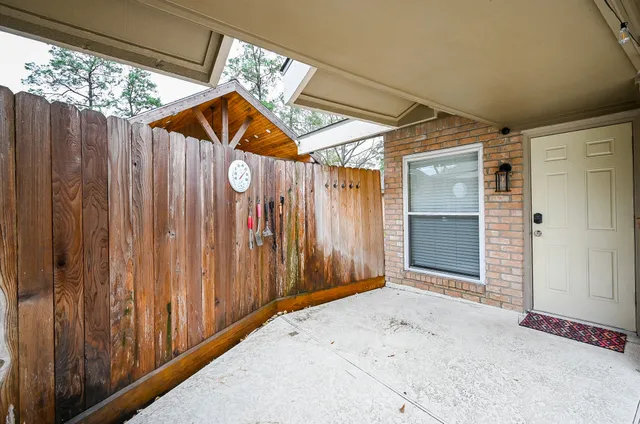 a view of a garage with wooden wall and door