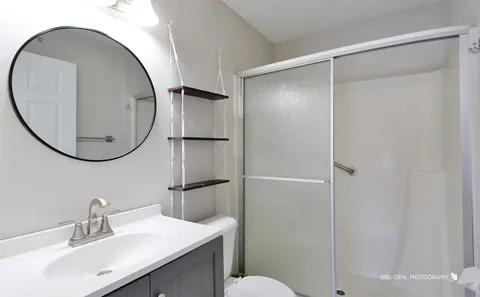a bathroom with a sink and a mirror