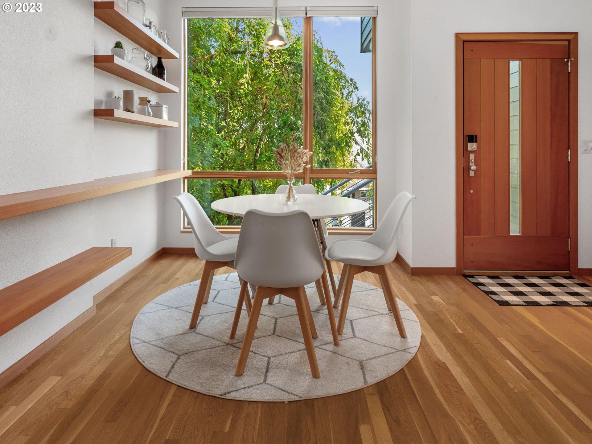 3727 Southwest Condor Lane Portland, OR 97239 - Photo 11 of 33 a view of a dining room with furniture window and wooden floor