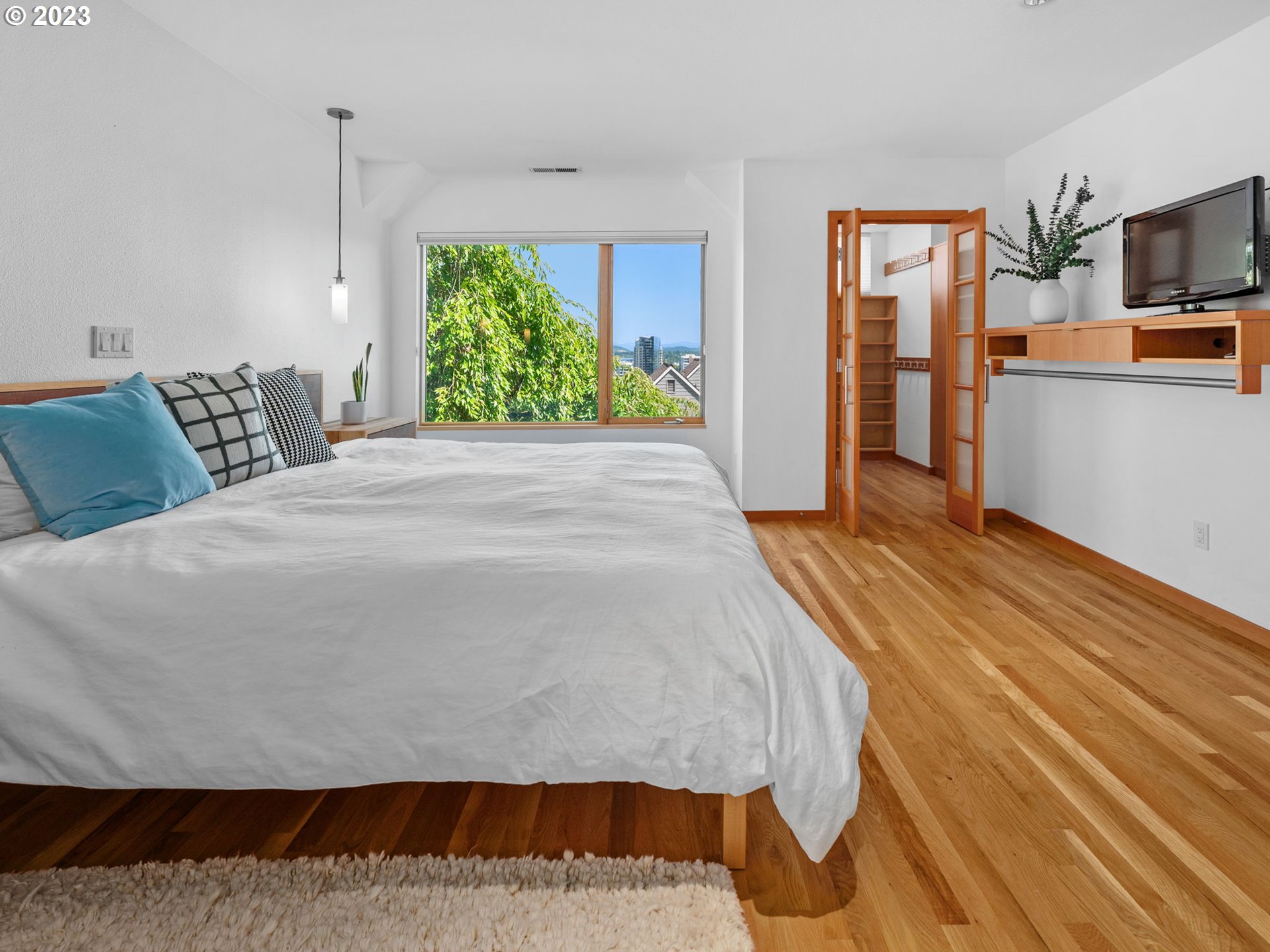 3727 Southwest Condor Lane Portland, OR 97239 - Photo 16 of 33 a bed room with a bed and a television