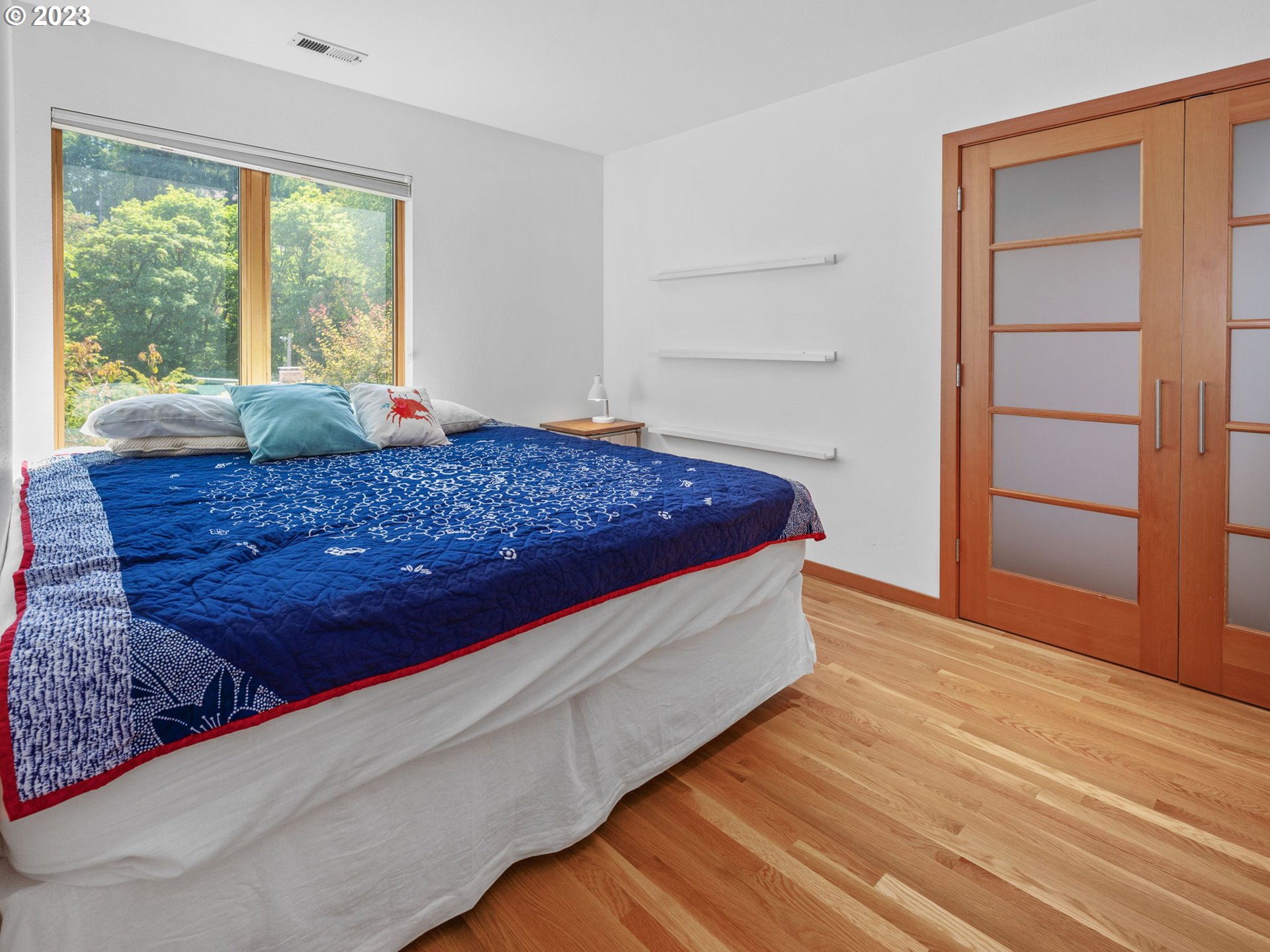 3727 Southwest Condor Lane Portland, OR 97239 - Photo 21 of 33 a bed room with a bed and a window