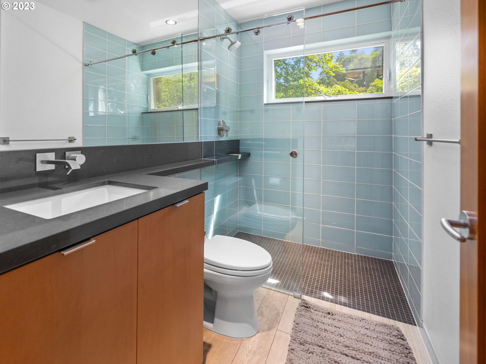 3727 Southwest Condor Lane Portland, OR 97239 - Photo 22 of 33 a bathroom with a sink a toilet and shower