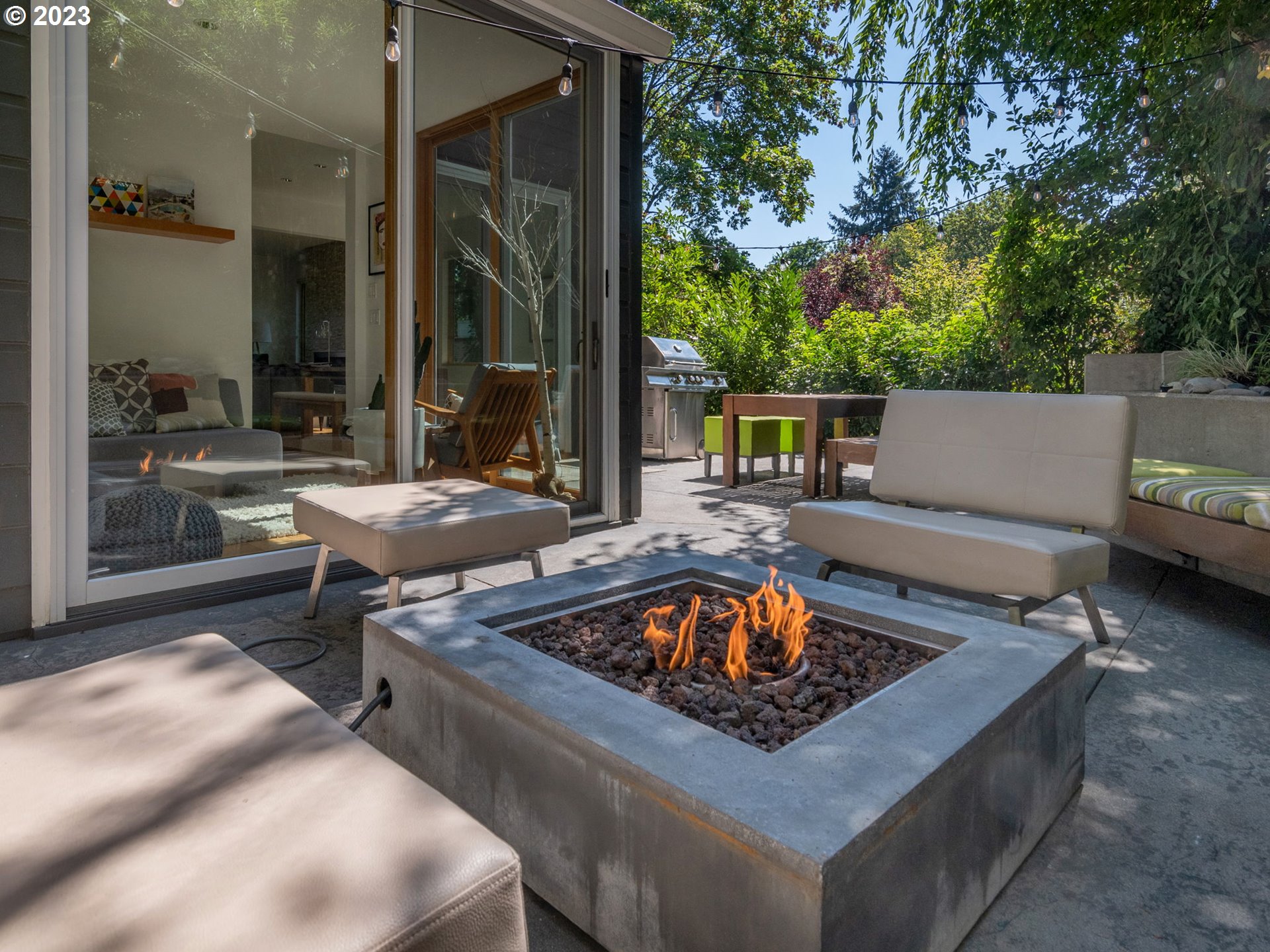 3727 Southwest Condor Lane Portland, OR 97239 - Photo 29 of 33 a outdoor living space with furniture and a fireplace