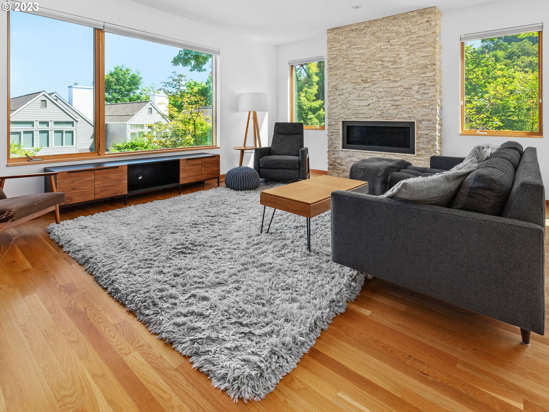 3727 Southwest Condor Lane Portland, OR 97239 - Photo 3 of 33 a living room with furniture and a fireplace