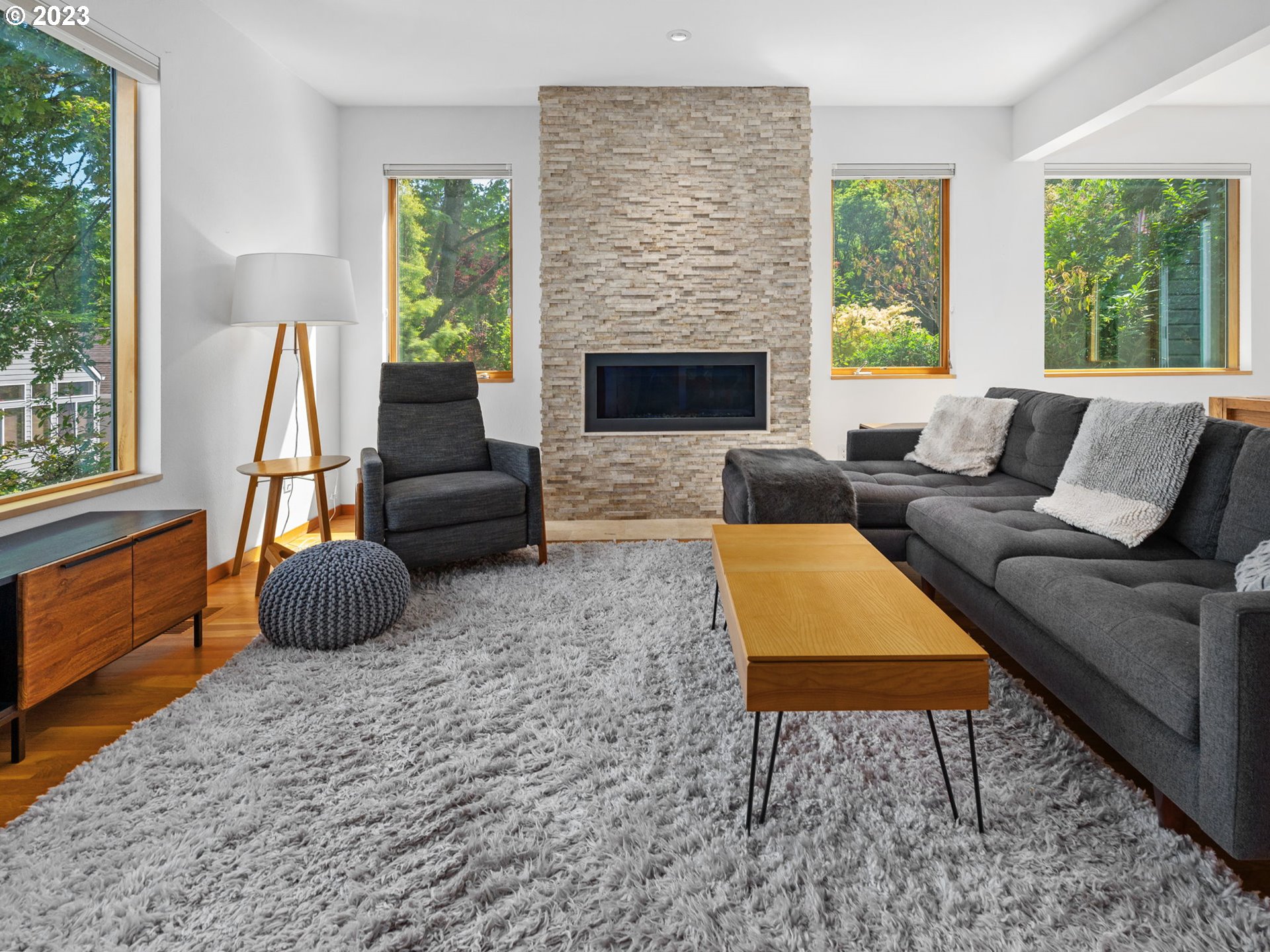 3727 Southwest Condor Lane Portland, OR 97239 - Photo 4 of 33 a living room with furniture and a fireplace