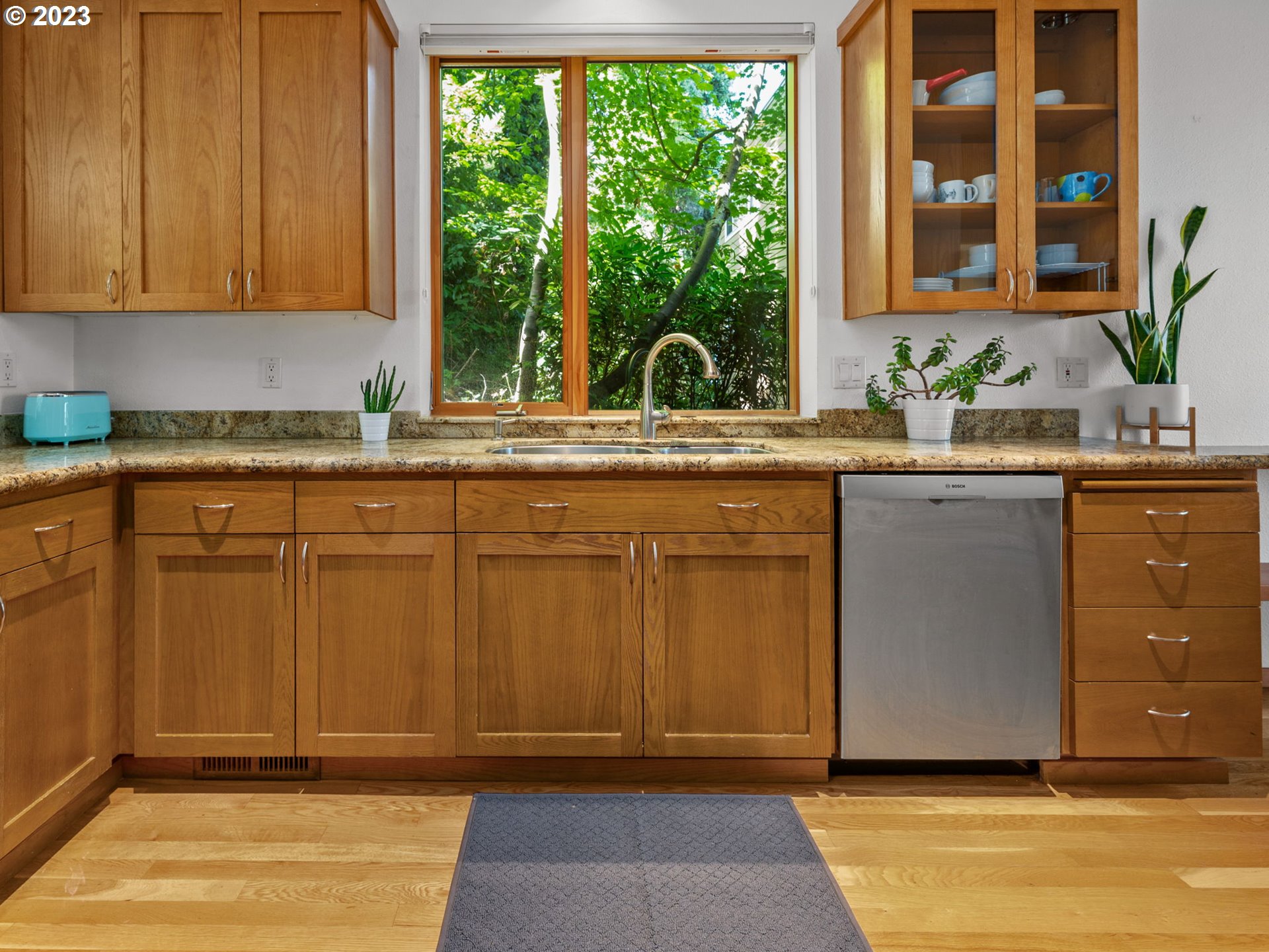 3727 Southwest Condor Lane Portland, OR 97239 - Photo 9 of 33 a kitchen with stainless steel appliances granite countertop a sink and a cabinets