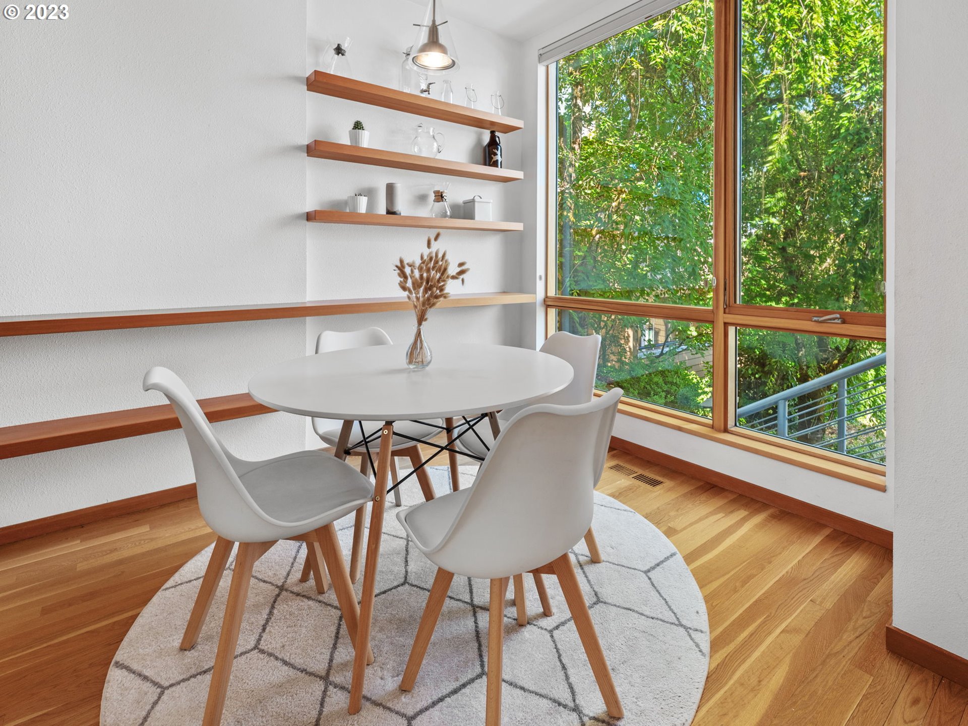 3727 Southwest Condor Lane Portland, OR 97239 - Photo 10 of 33 a view of a dining room with furniture window and wooden floor