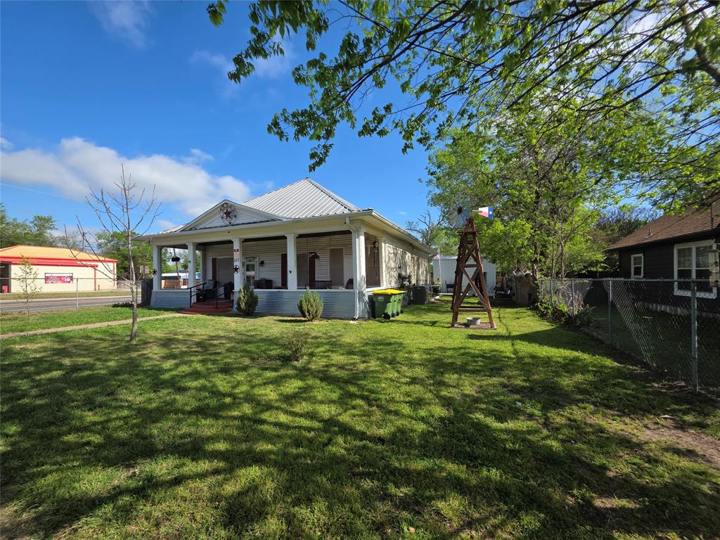 211 West Sabine Street Groesbeck, TX 76642 - Photo 1 of 40 a view of a house with a yard