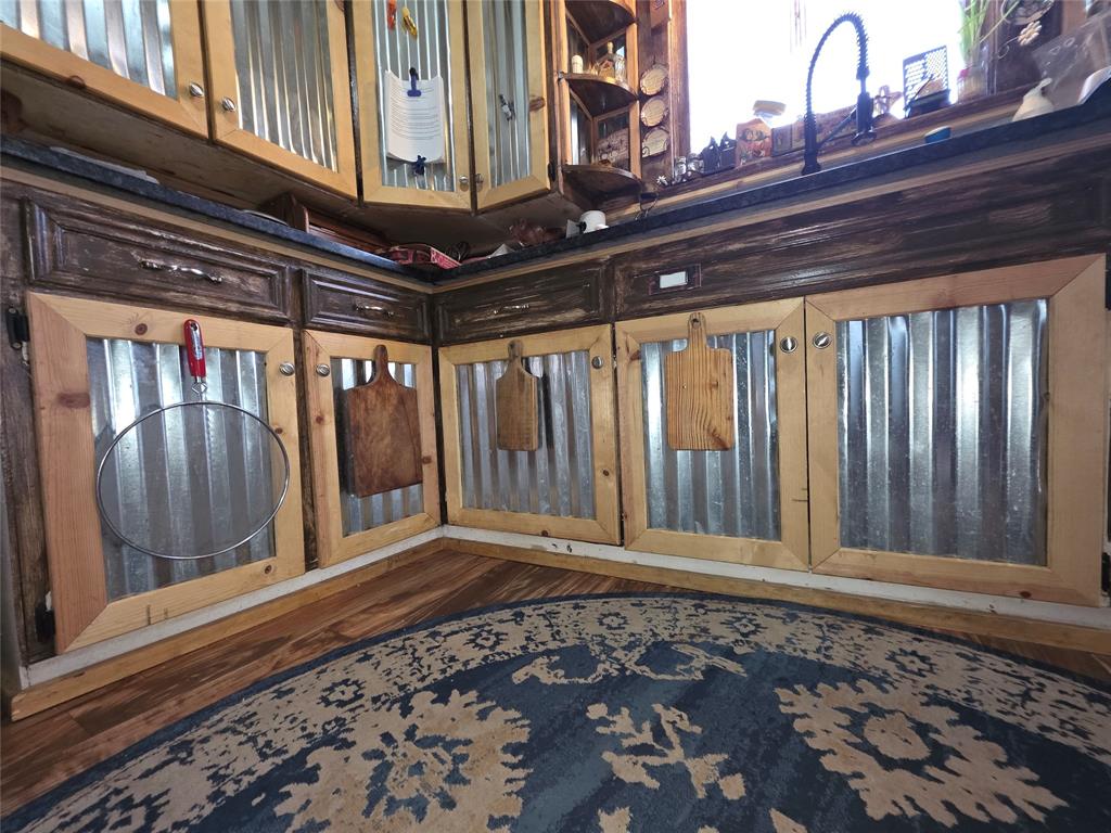 211 West Sabine Street Groesbeck, TX 76642 - Photo 16 of 40 a view of a room with wooden floor