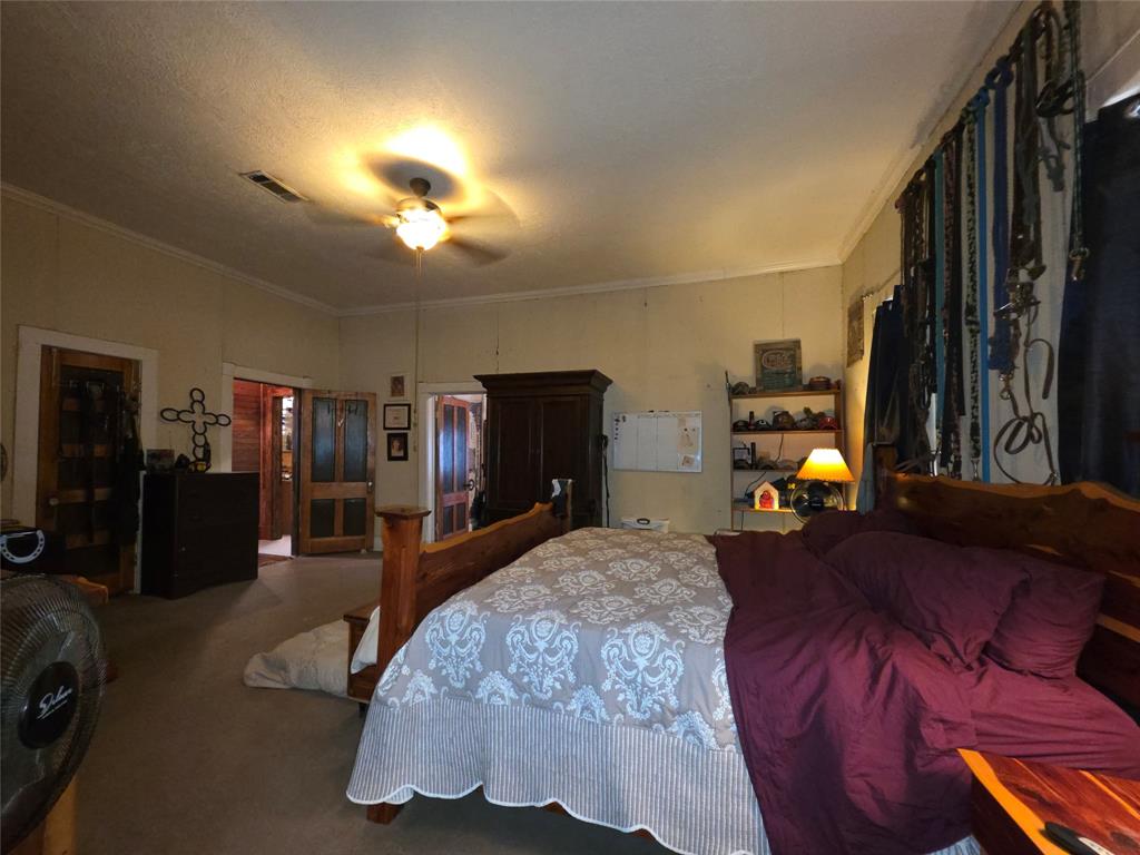 211 West Sabine Street Groesbeck, TX 76642 - Photo 24 of 40 a bed room with a bed and a tv